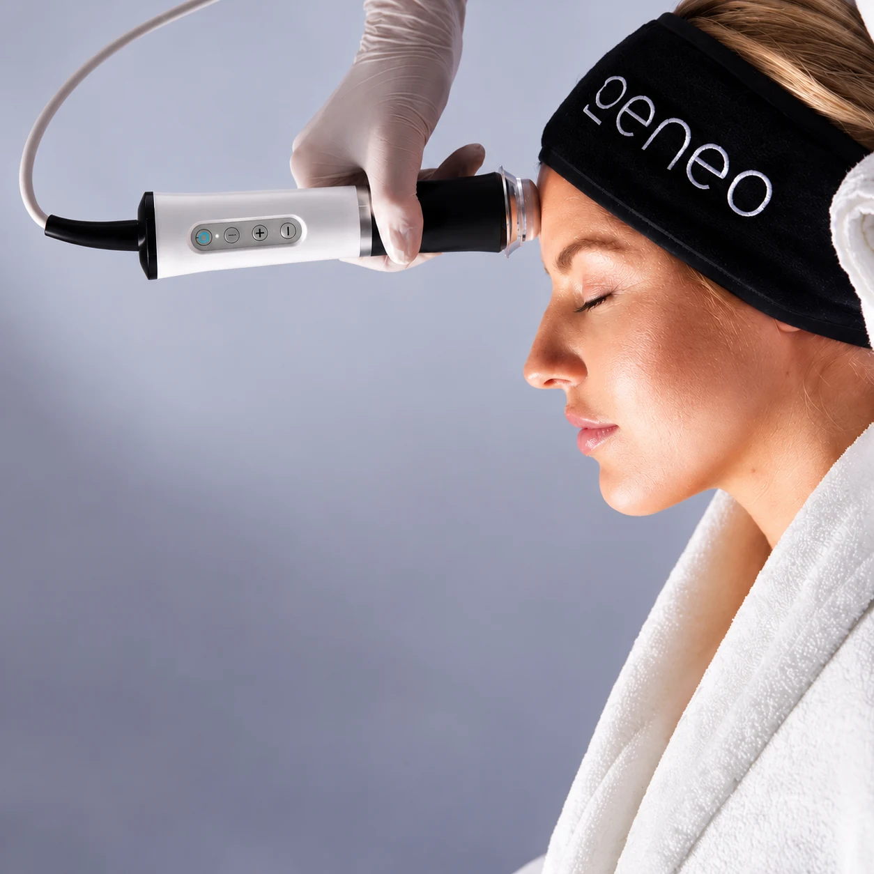 Geneo facial treatment with handpiece and Geneo headband